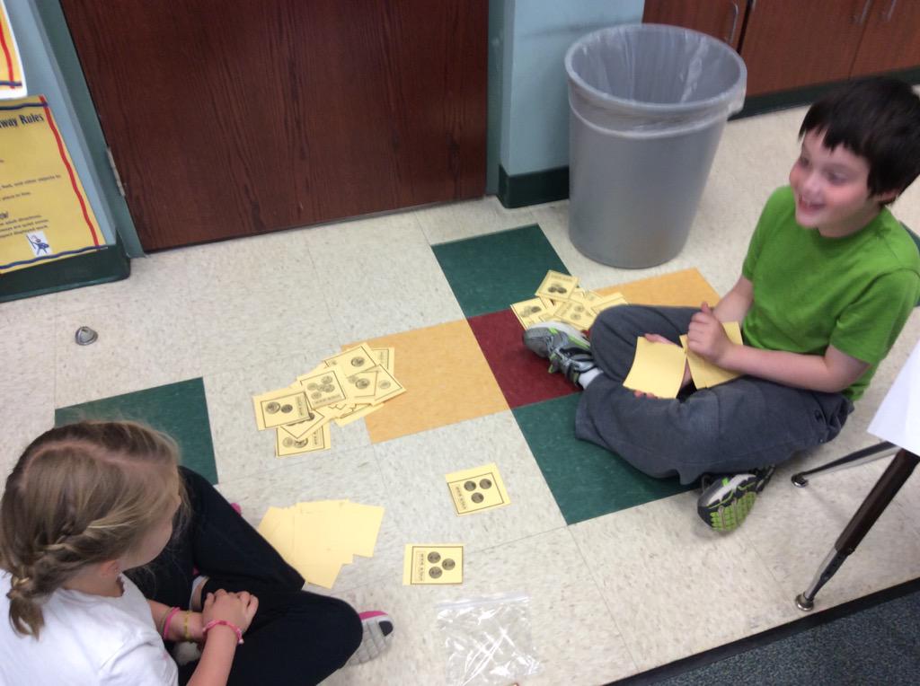 Grade2WolfPack's tweet photo. WolfPack practicing with money. Coin War! @NTMPrincipal http://t.co/EaYV976HGR
