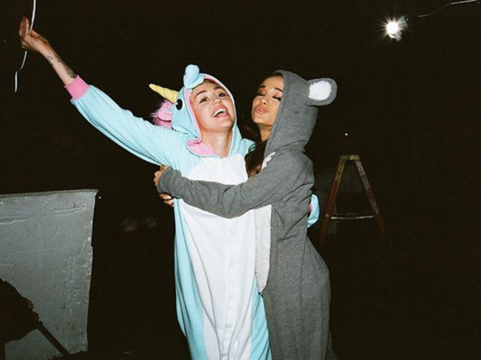 RapUp's tweet photo. Miley Cyrus Duets with Ariana Grande, Covers Khia's 'My Neck, My Back' http://t.co/MtVE1oSSWY http://t.co/ZHu41lLjtA