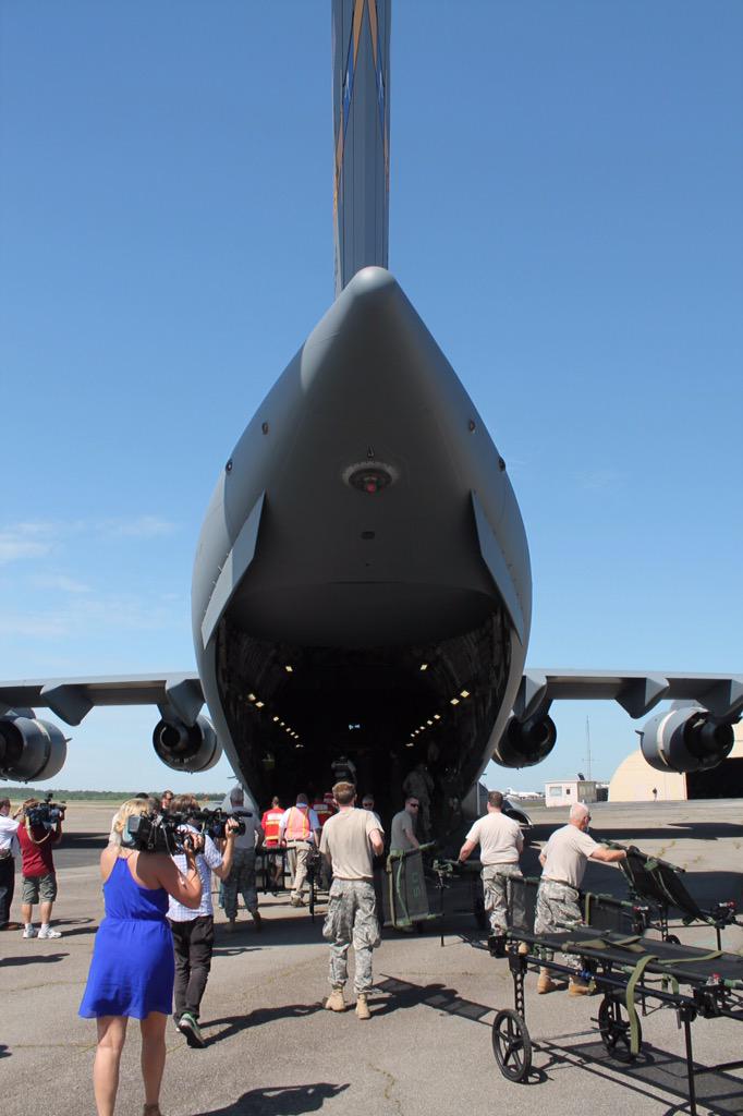 Mock "patients" are offloaded from a C-17 during #SCNDMS15