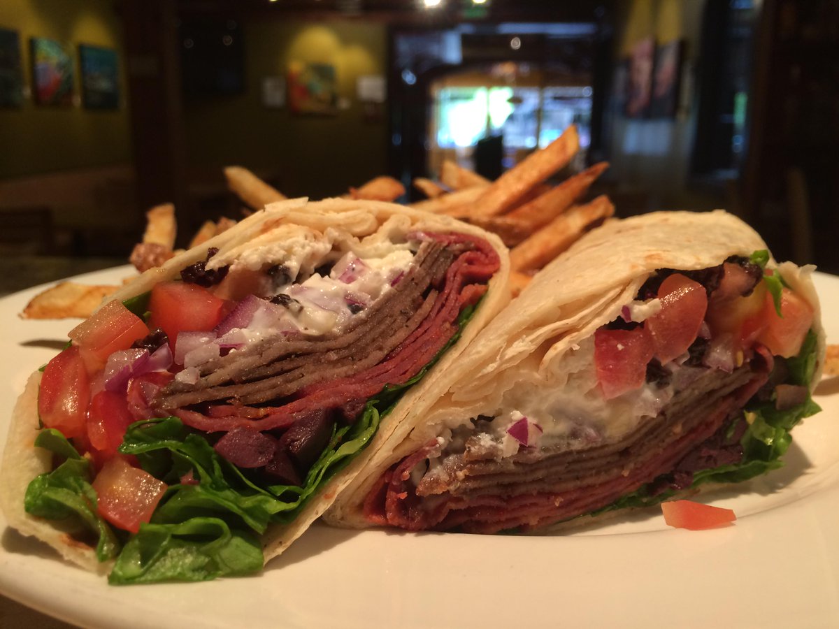 The Zeus Wrap includes capicola, lamb, feta, tzatziki, fresh red onion, tomato, lettuce, currants and kalamata olives