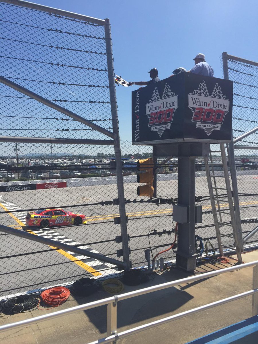 WinnDixieDella's tweet photo. Winn-Dixie District Director Eugene Okorley waves the checkered flag for qualifying laps at #WinnDixie300 http://t.co/FH9eXiIzAj