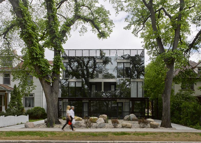 dezeen's tweet photo. Reflective glass on the front of this building in Winnipeg mirrors the street: http://t.co/eV6J07vnye http://t.co/Eh0P0G2Rzj