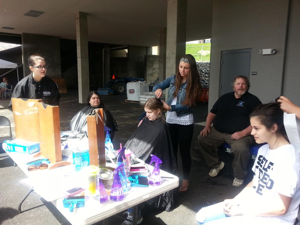 Senior cosmetology cutting at UEHS for Children With  Hair Loss