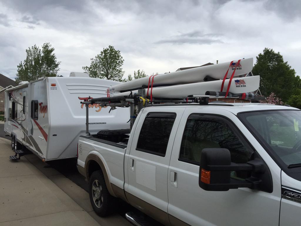 2 Engel Express Angler paddle boards up top and 3 Bulldog Folding Kayak Trailers in the back.