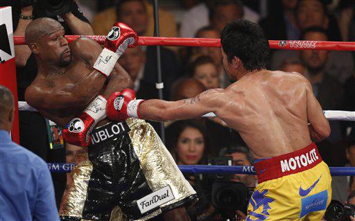 AP's tweet photo. Some of our best @AP_Images so far from #PacquiaoMayweather fight: http://t.co/3tVXqQ0uH7