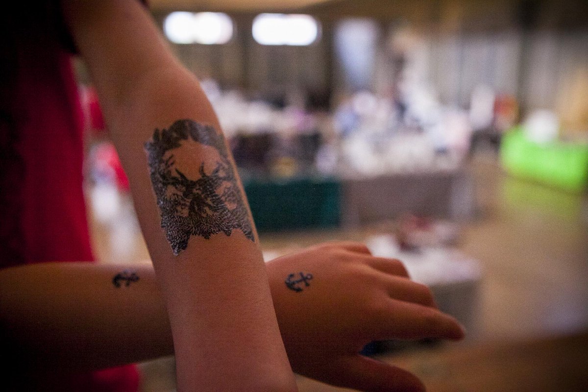 jumpingSOFA's tweet photo. Children having good time tatooing with @EsotericLDN at #intrigueemporium great fair in Shoreditch Town Hall http://t.co/e9jjlu0nbO