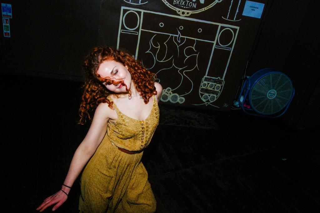 This girl's on fire #redhead #dancefloor #furnace #candid #clubphotography