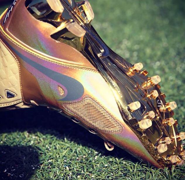 gold plated football cleats