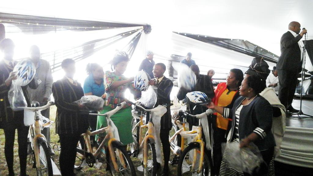 ECTransportDep's tweet photo. MTN handing over bicycles and helmets to school kids with the Deputy Minister and MEC. http://t.co/KHxJxf0weR
