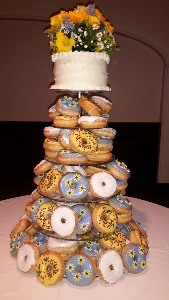 frenchvillage's tweet photo. The first donut wedding cake of many this season #weddingcake #newcraze #fvb #donuts #sunflowertheme http://t.co/N5gXubUGO8