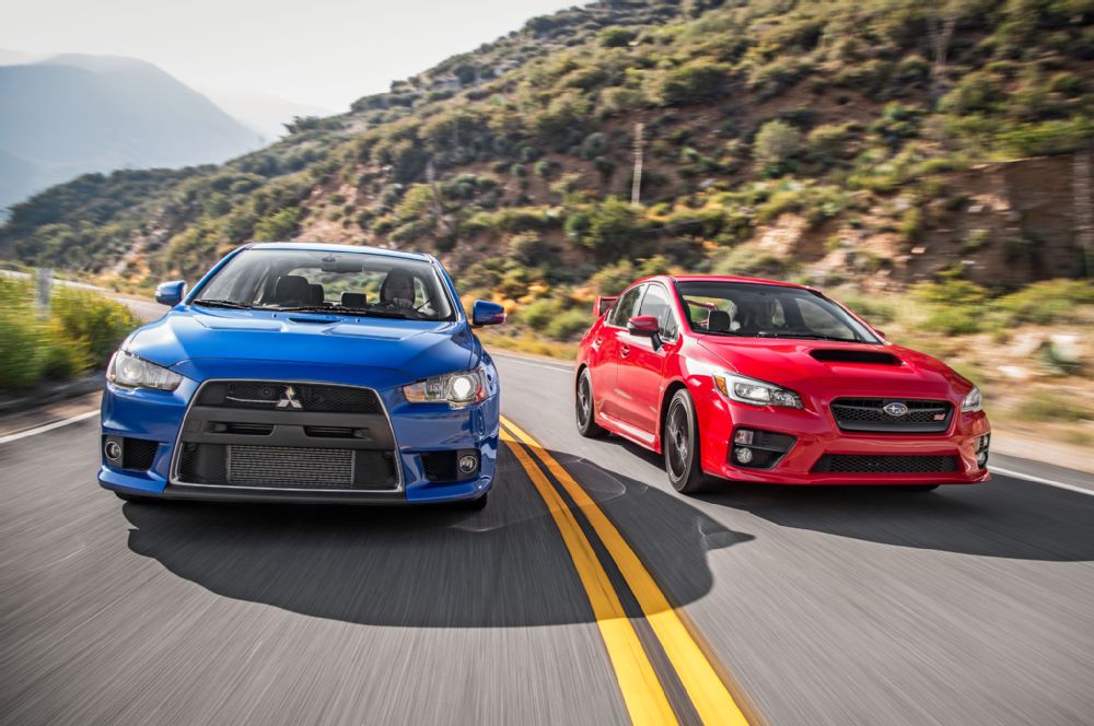 automobilemag's tweet photo. The End of a Rivalry: #Mitsubishi Lancer Evolution MR and #Subaru WRX STI: http://t.co/LSHL3A3Pyw http://t.co/3AilsWKZR8