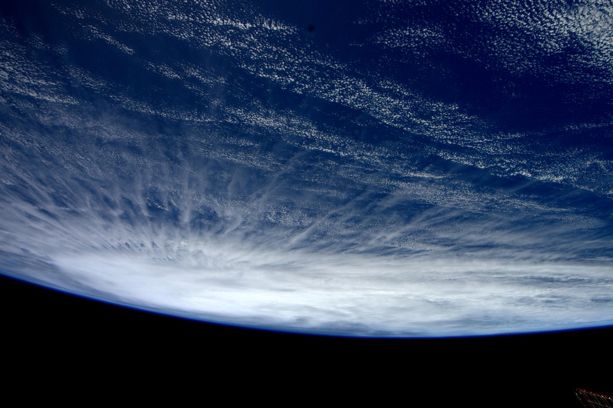 AstroSamantha's tweet photo. A sinister looking cyclone rising on the horizon last March, even from above they command respect. #HelloEarth http://t.co/CEzYcvSDFx
