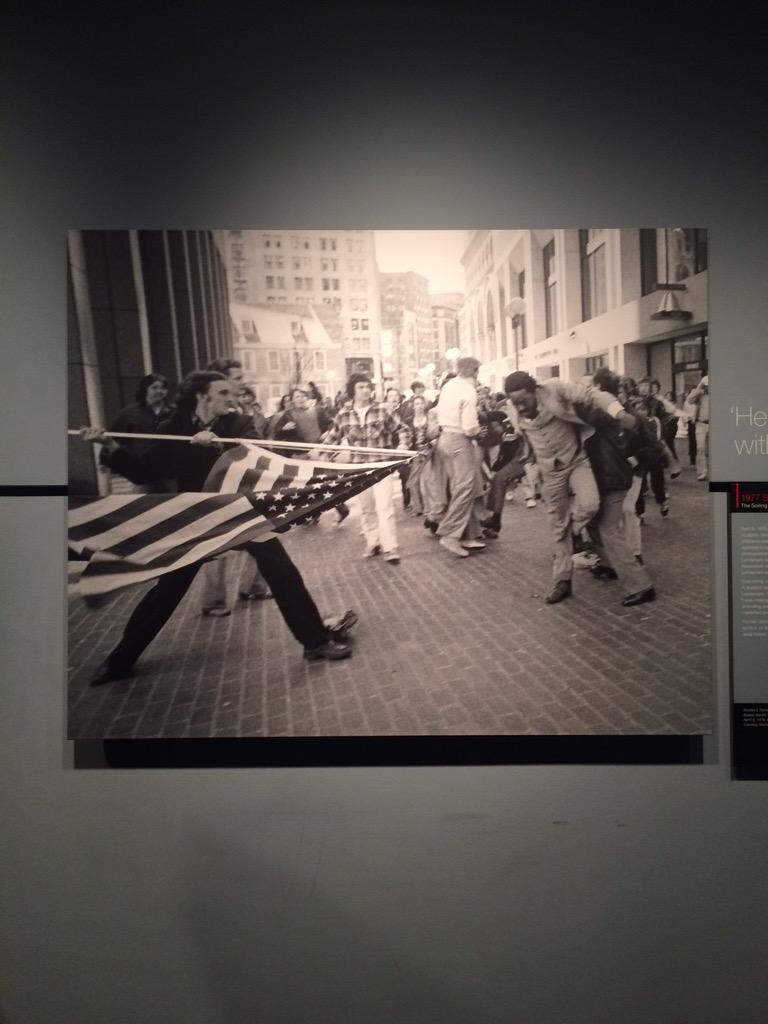 Sarahdc2015's tweet photo. Newseum Pulitzer Prize winning photo. The irony of one American attacking another with our flag; winning. #dcskylion http://t.co/hBtCMt6u7x