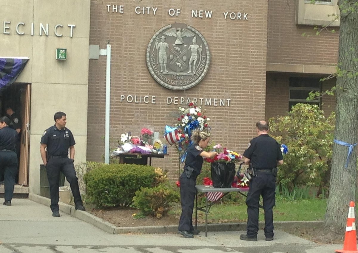 katcreag4NY's tweet photo. #NYPD #105Precinct adding more tables for flowers left in honor of Officer #BrianMoore #NBC4NY http://t.co/g3k6nGTiVl