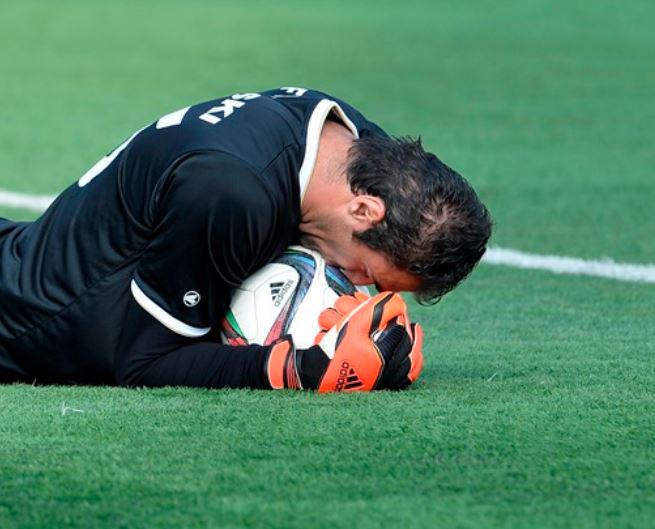 Tofiloski holds on to the ball after making a save