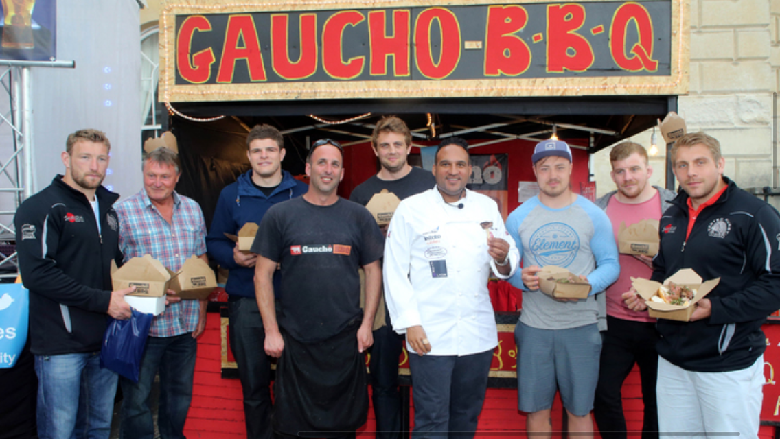 <a href="/ExeterChiefs/">Exeter Chiefs</a> &amp; <a href="/michaelcaines/">Michael Caines MBE DL</a> enjoying a <a href="/GauchoBBQUK/">Gaucho bbq</a> at <a href="/ExeterCastle/">Exeter Castle</a> during the <a href="/ExeterFoodFest/">Exeter Food Festival</a>