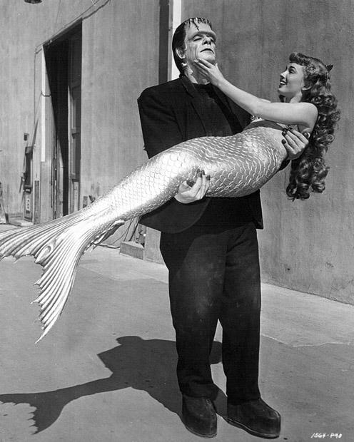 HistoryInPics's tweet photo. Glenn Strange as Frankenstein's monster, and Ann Blyth as a mermaid, meet on the Universal lot, 1948. http://t.co/4sWd4eMynH