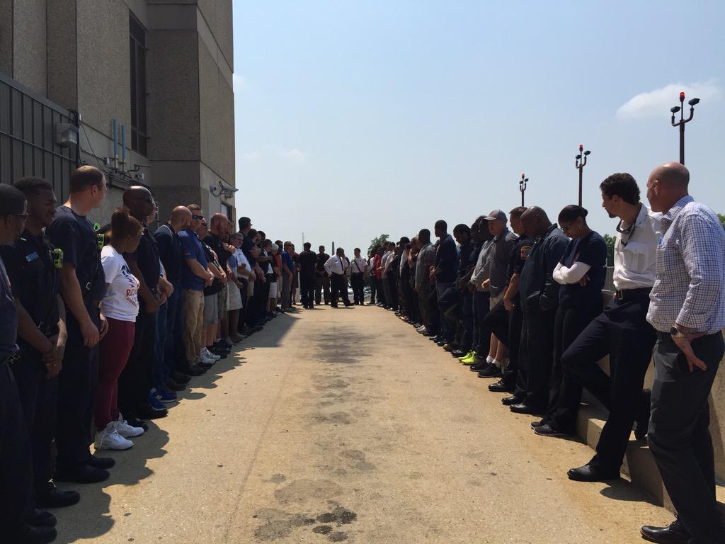 dcfireems's tweet image. Members await the body of Lt. Kevin McRae to be carried out of the hospital.