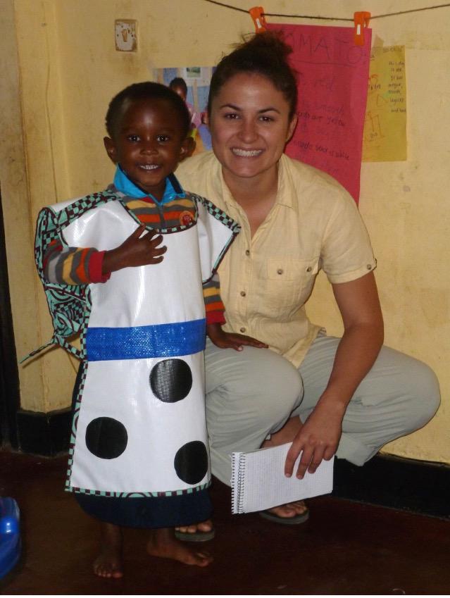 Smocks4Kids's tweet photo. UPDATE:

This is Happy wearing a smock prototype with TEACH Rwanda's board secretary, Kelly! http://t.co/72Eu0dzPyK