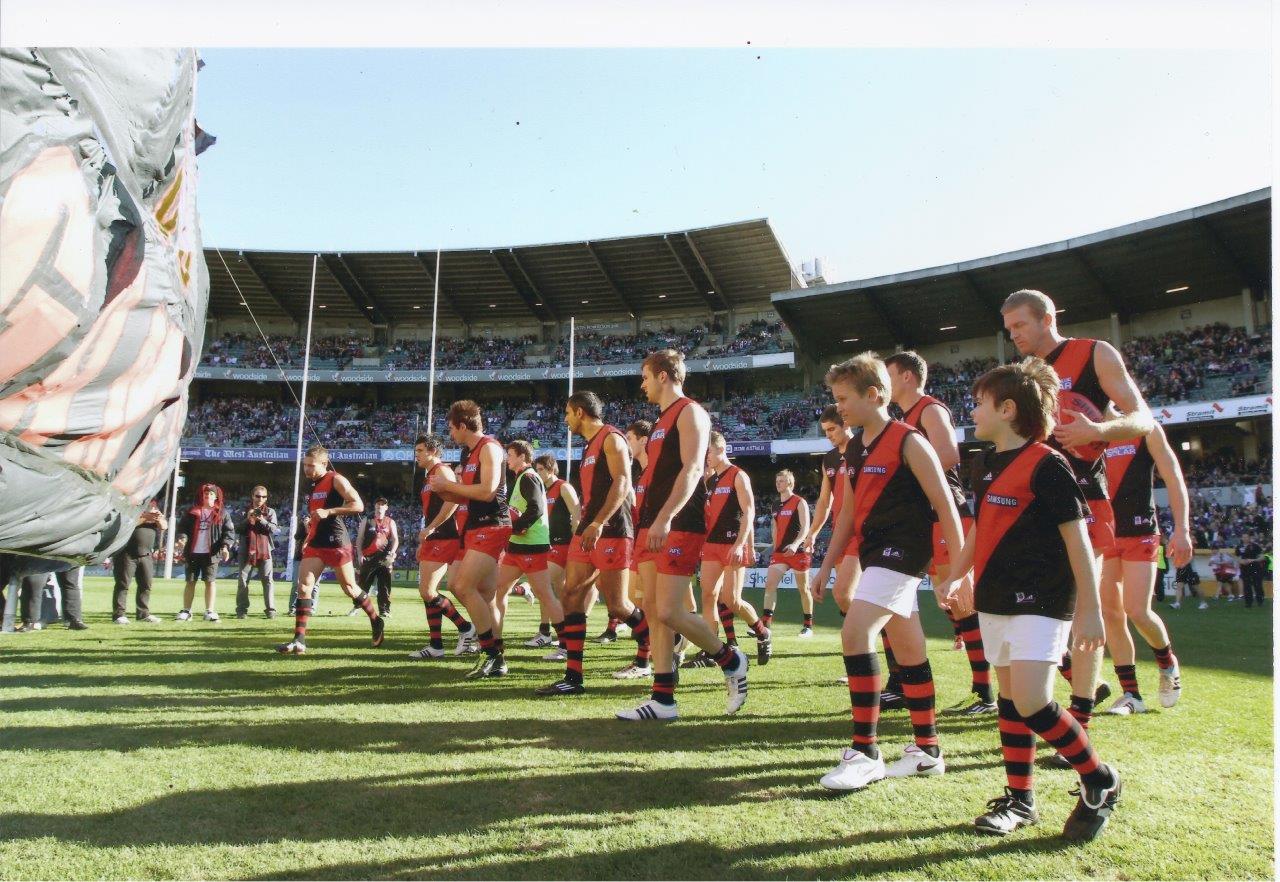 Happy Birthday young Dustin Fletcher. Here he is guiding my 2 boys thru banner V Freo, such a gentleman 