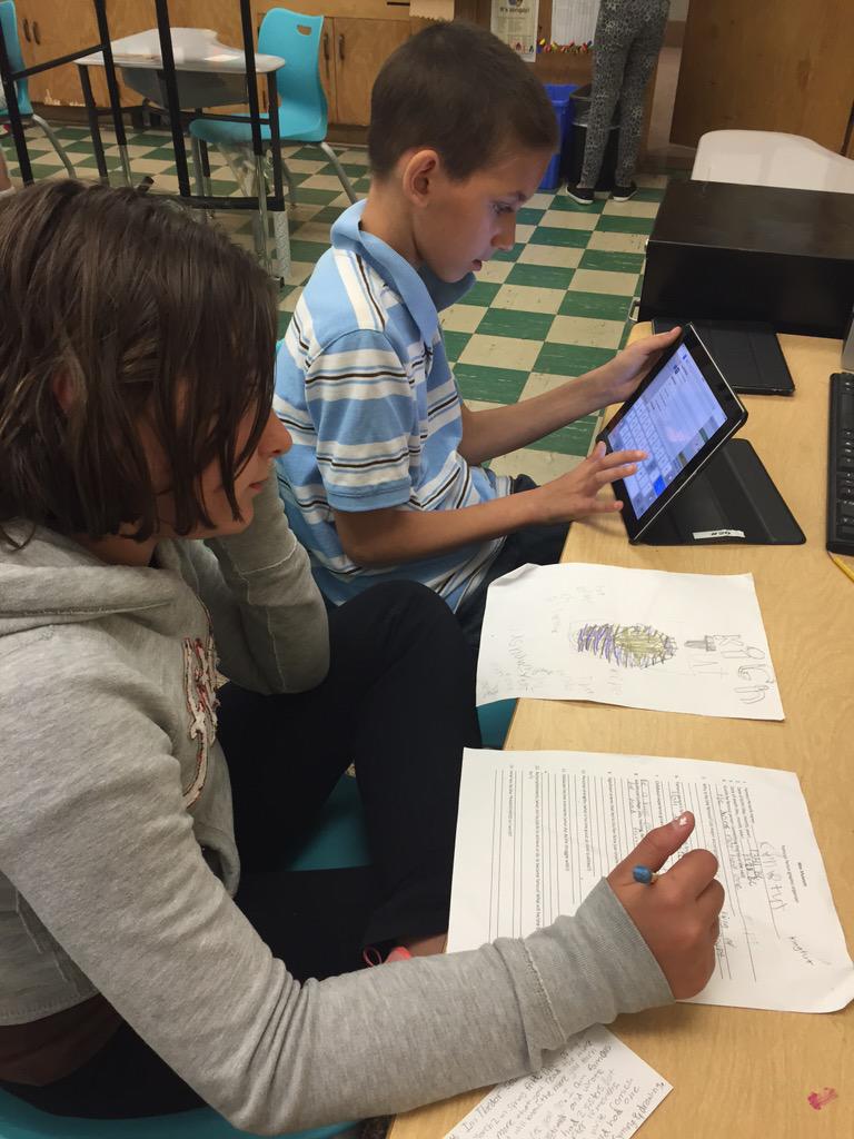 Dwyer5th's tweet photo. A student is helping another student with his research! Proud teacher moment! They have grown so much! @wrightdmps http://t.co/im9LakW9lE