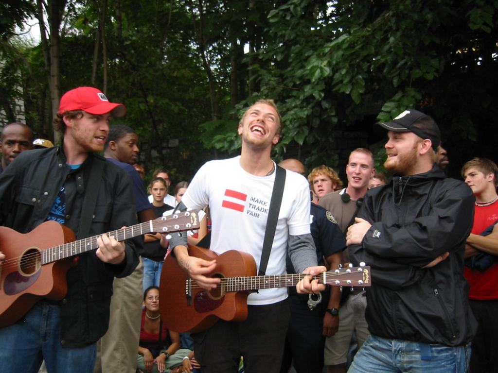 coldplay's tweet image. #TBT Playing to fans in an Atlanta car park in September 2002 after a huge storm cancelled a show. A