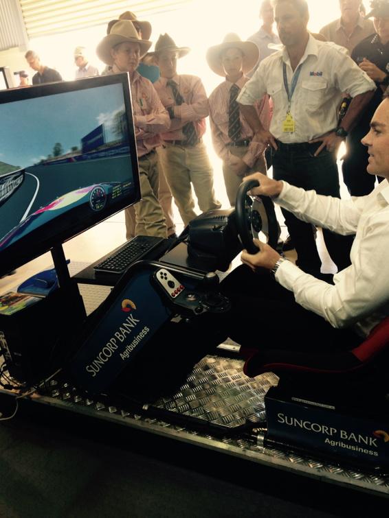 gilly381's tweet photo. No pressure on this bloke to nail fastest lap on V8 simulator! @craiglowndes888 @suncorpbank #Beef2015 http://t.co/ePKa4H08kJ