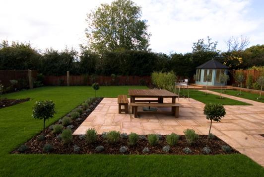 Formal design with bamboo screen and Indian sandstone paving