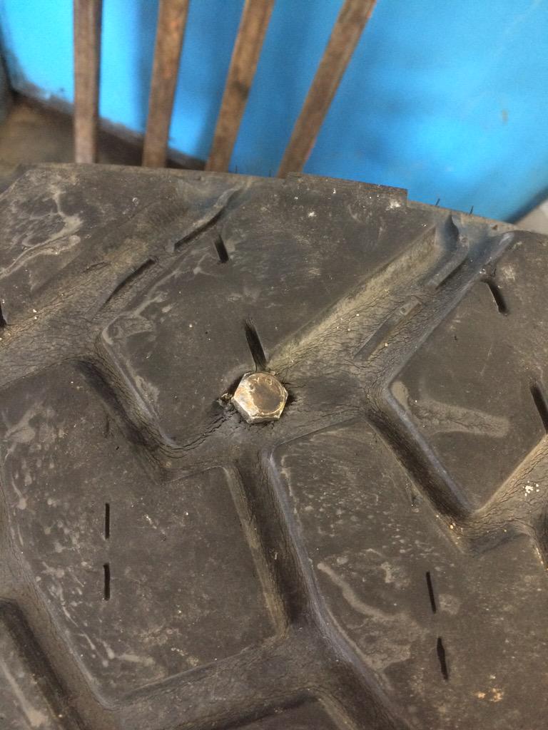 GarrettOberle's tweet photo. This is how we plug tires in #centralkansas @Werthmorethanu http://t.co/afn9Ury4i9