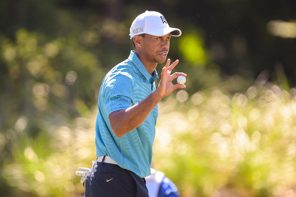 PGATour's tweet photo. Tiger converted the putt he needed most Friday. He believes he can narrow the gap this weekend http://t.co/xGx6PWl3xM http://t.co/tgY0ONV3Ot