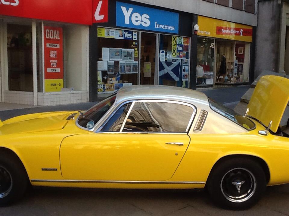 #inverness vintage car rally on today.  Seemed appropriate for them to park #SNP yellow car outside the Yes Hub :)