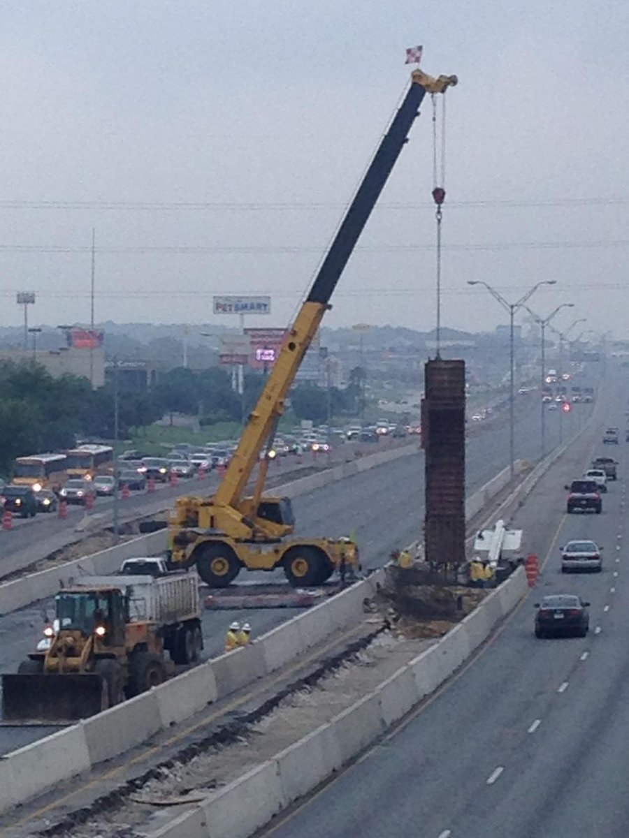 TxDOTSanAntonio's tweet photo. Williams Bros Construction building a hwy sign support column while bridge beams are en route. No wasted time! #US281 http://t.co/CkN378llSW