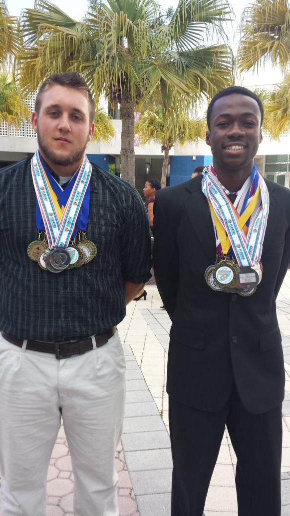 BobcatFBallMom's tweet photo. Pre Awards pic @WillGlesge6997 and @ibbiejames11 with their hardware from the season!  #TrackNation #FieldDomination http://t.co/s1XY75ywyO