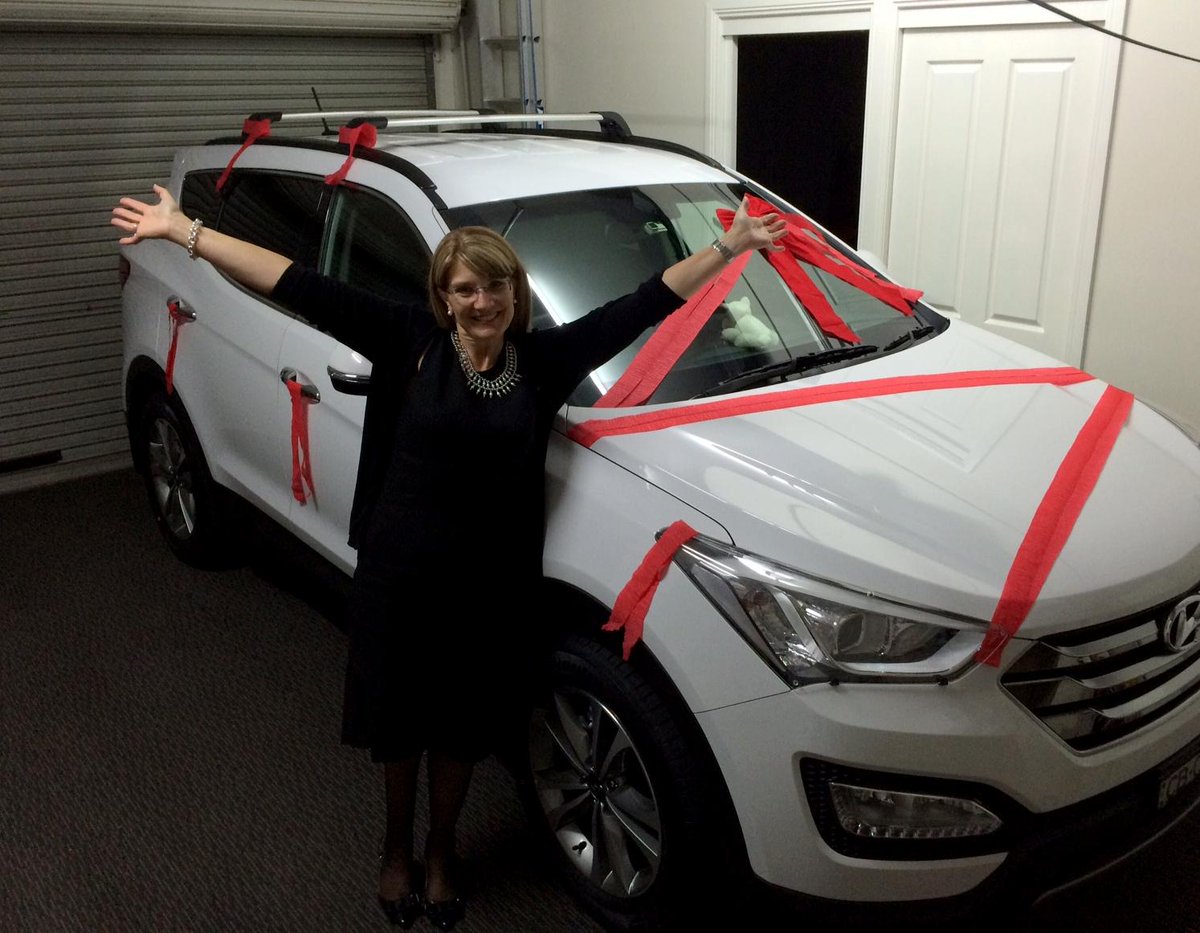 One very ecstatic customer with her surprise 50th Birthday present...a Brand New Hyundai Santa Fe!