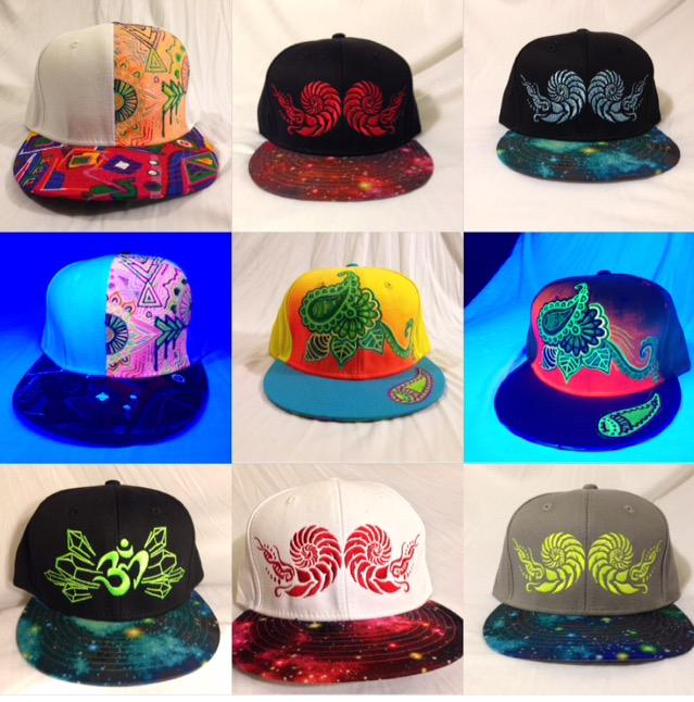 ConsciousCreatu's tweet photo. some of our original designs... The hand painted ones were made by @LynziesArt #hat #swag #glow #edc #vegas #art #new http://t.co/7GQUC1kYmO