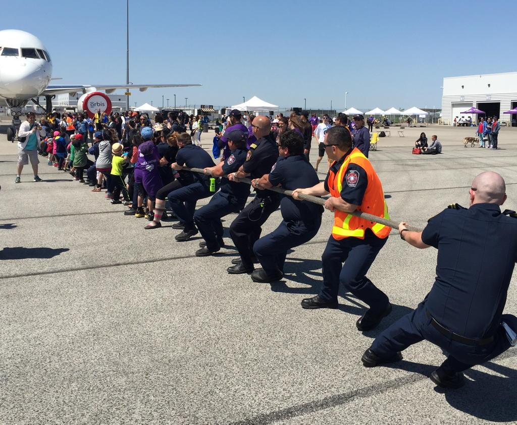 Kennedy_JK_'s tweet photo. Pearson Fire helping the kids pull a plane @orbisplanepull @torontopearson http://t.co/Ykot9EU2Lp