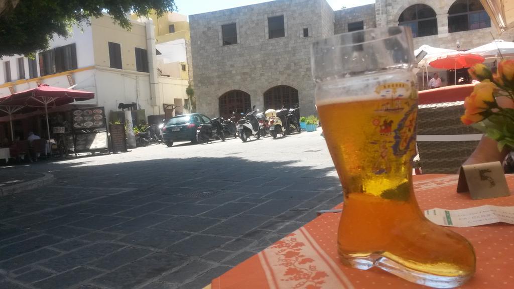 BennetStone's tweet photo. Stay classy Greece! In the beautiful historic Rhodes Town and they serve my beer in a fucking welly! #bladderburst! http://t.co/Z1mNdgVzT6