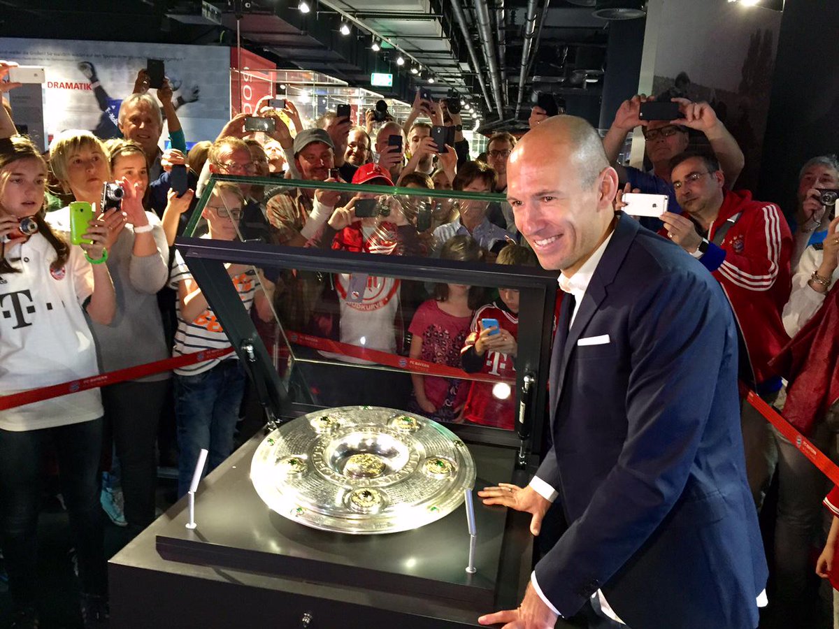 FCBayernEN's tweet photo. And there he is! Arjen #Robben brings the BL trophy for the fans to see. "Winning the title is a great feeling!" http://t.co/54gr6CPEFU