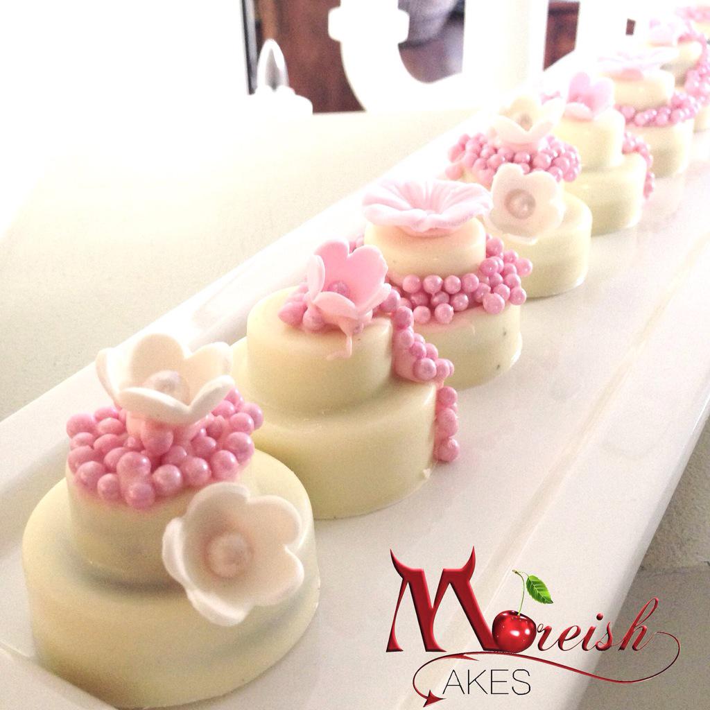 Moreish's tweet photo. These adorable mini wedding cakes are chocolate coated Oreos both mini and regular for a pretty kitchen tea. http://t.co/EBXHmQ9In0