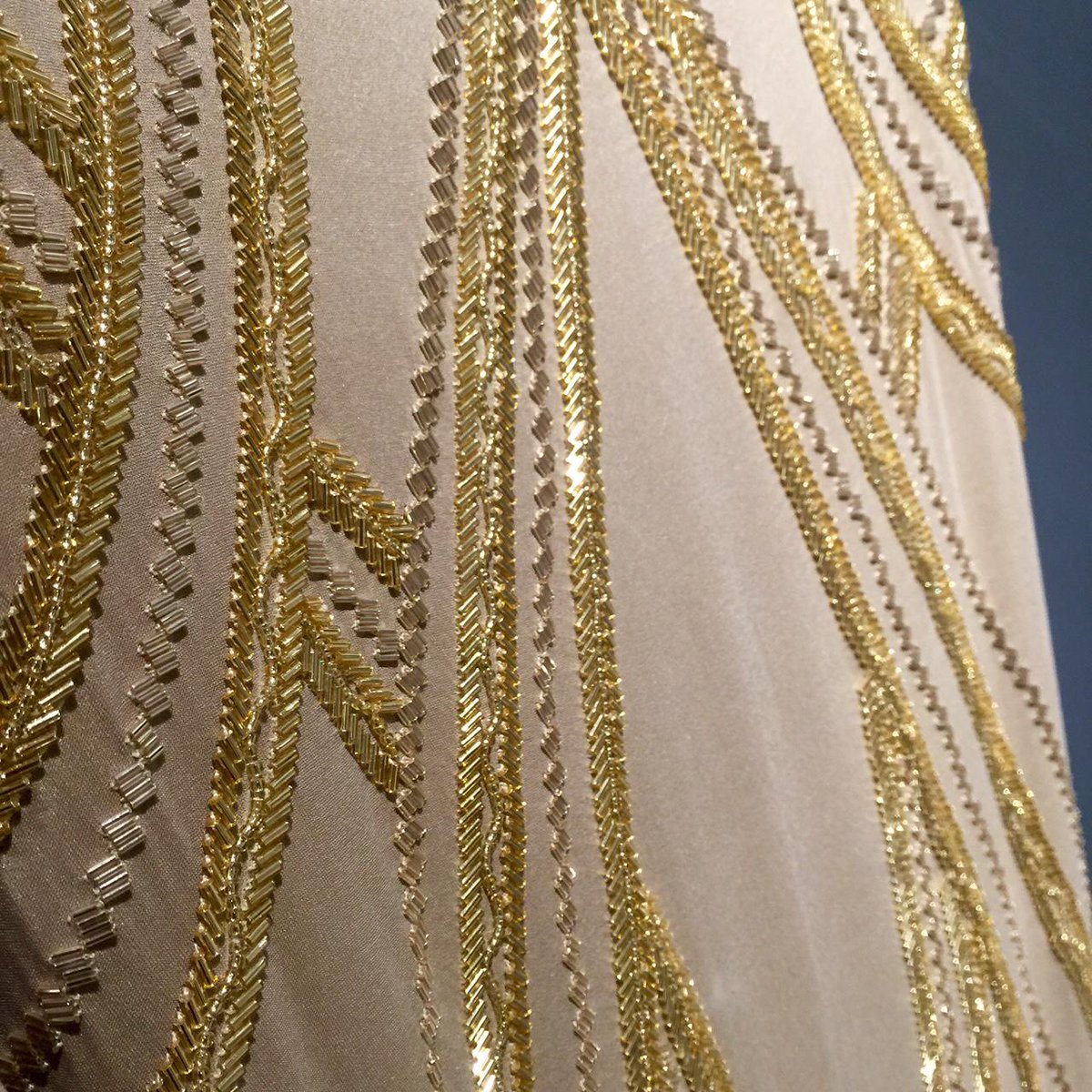 Glamorous gold beading on this JLo-inspired long gown by Nicole Miller 
#beading #dress #gown #fashion #blingbling