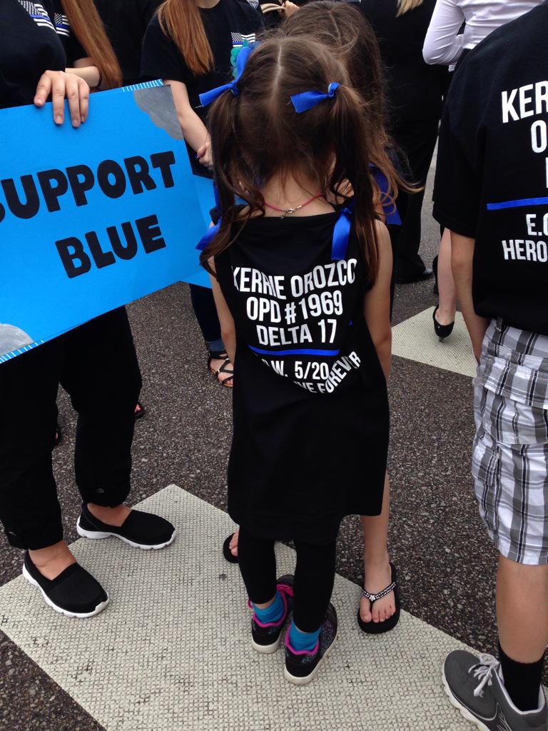 At 10th &amp; Douglas, waiting for funeral procession to pass. Here too are soldiers in fatigues, businessmen in suits ..