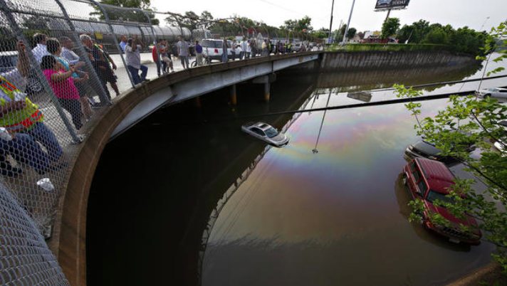 CBSNews's tweet photo. PHOTOS: Storms continue to drench Texas; a look at the #HoustonFlood http://t.co/uQMdQ5WjVv http://t.co/ojqAv6w4G5