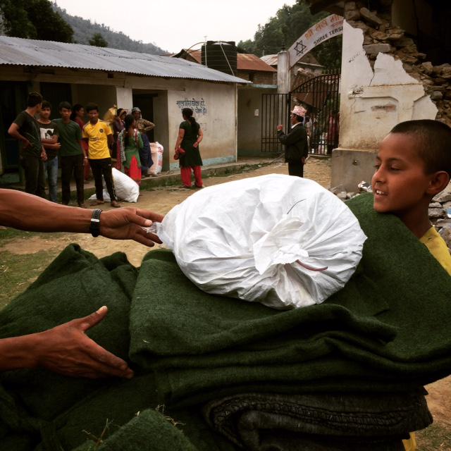 Concern's tweet photo. Distributions in full swing in Sindupolchowk district today, helping families affected by the #NepalEarthquake http://t.co/hcAnNuQFFI