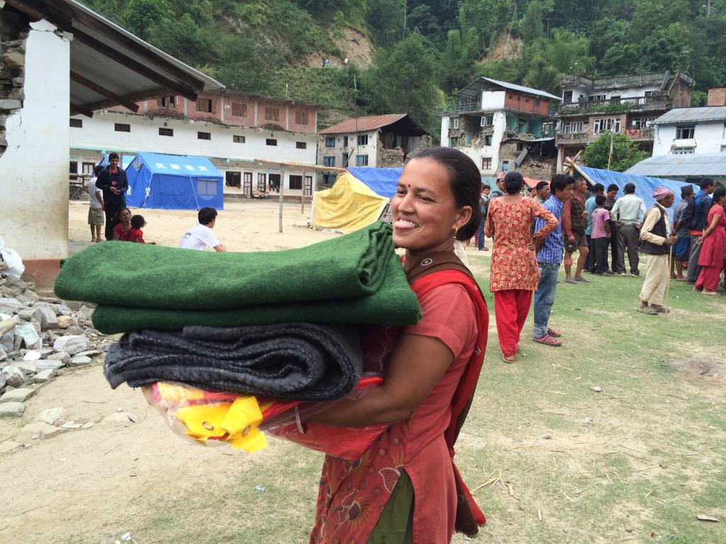 Concern's tweet photo. Distributions in full swing in Sindupolchowk district today, helping families affected by the #NepalEarthquake http://t.co/hcAnNuQFFI
