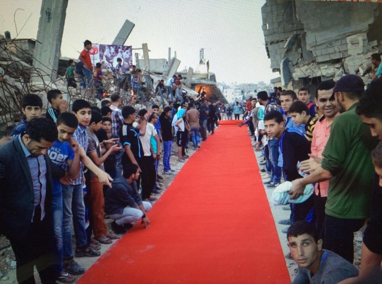 LeilZahra's tweet photo. Red carpet #Gaza #HumanRights #Film Festival 2015 in the middle of #Israel's #OpProtectiveEdge destruction #Palestine http://t.co/QNxpYUcTqY