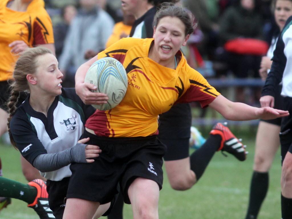 Crocus Plains' Emma Machado gets tackled by Dauphin Clippers' Kalee Dyck during high school girl's rugby action