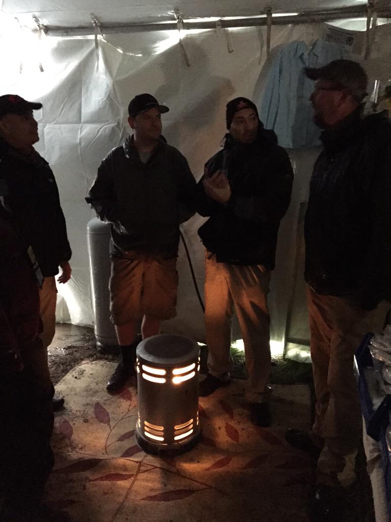 ExpApparel's tweet image. Warming up in the ExpeditionApparel tent after a day of rain and snow at Overland Expo
