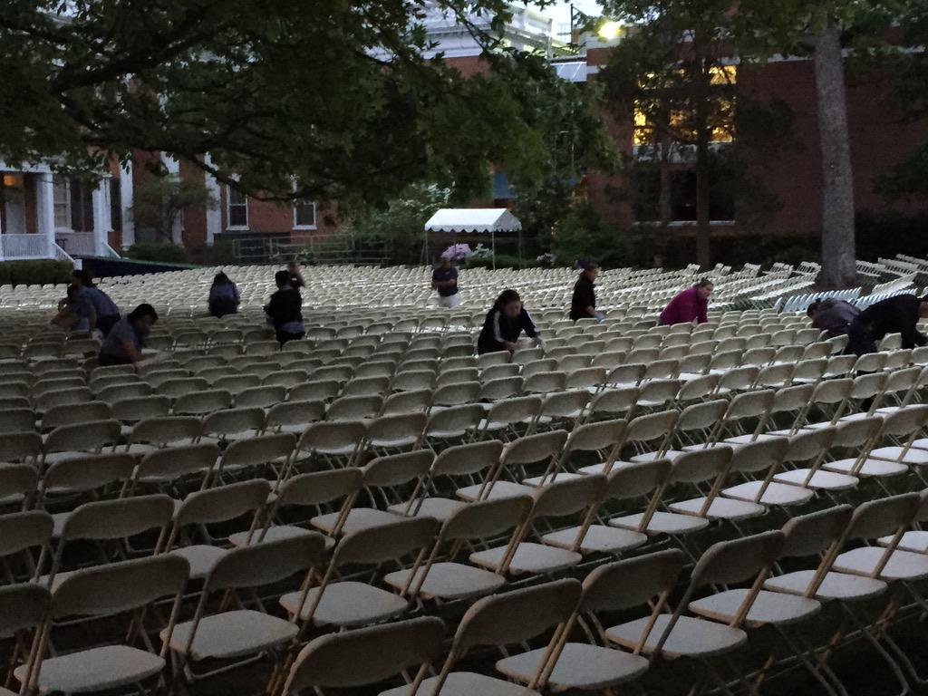 drewfacilities's tweet photo. Its 5 AM and we are wiping down the chairs! No rain so far! #GradDREWation http://t.co/oRSTsqLqvD