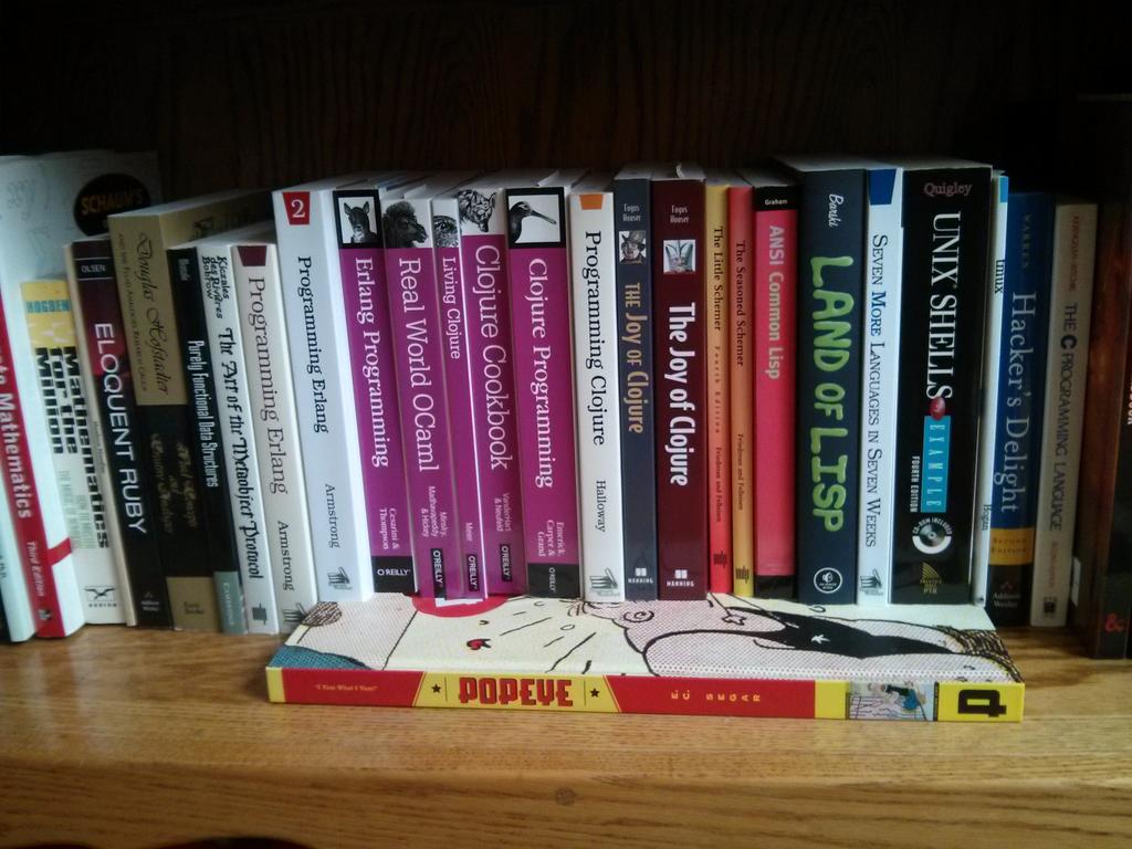 defndaines's tweet photo. And the winners are .... Books that survived the purge. #Clojue #Erlang #LISP http://t.co/29Azcj72Mq