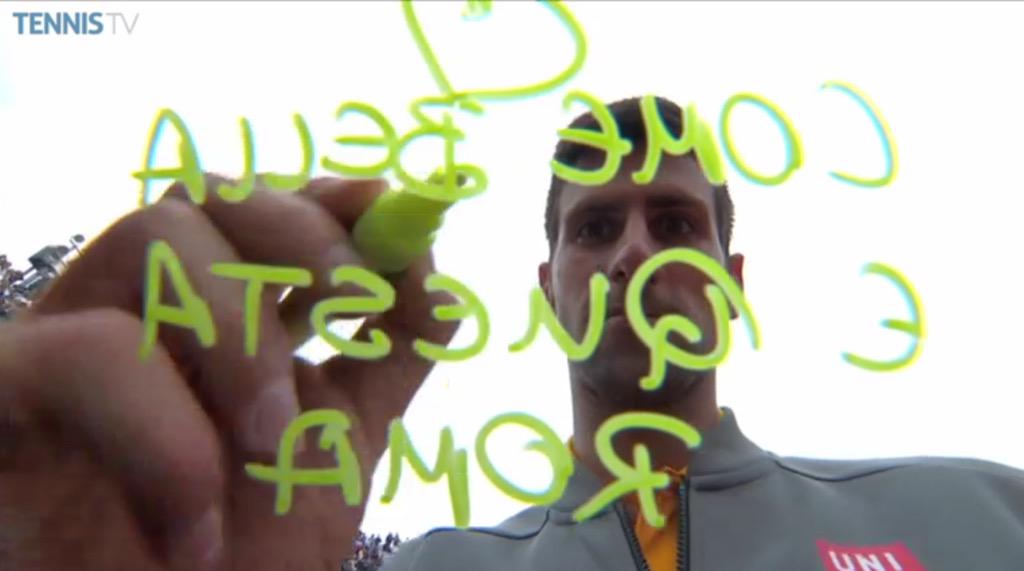 federering's tweet photo. Novak signing the camera #thatconcentration http://t.co/UkMXq9bRnu